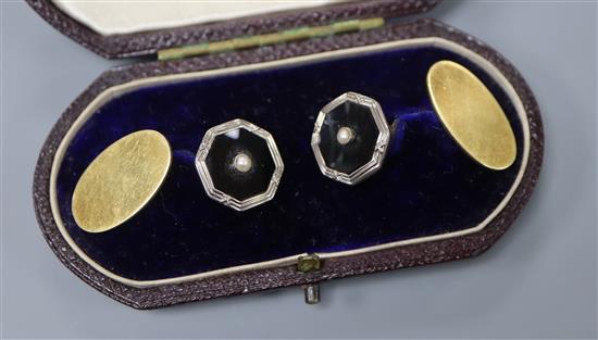 A cased pair of 18ct, black onyx and seed pearl set cufflinks.